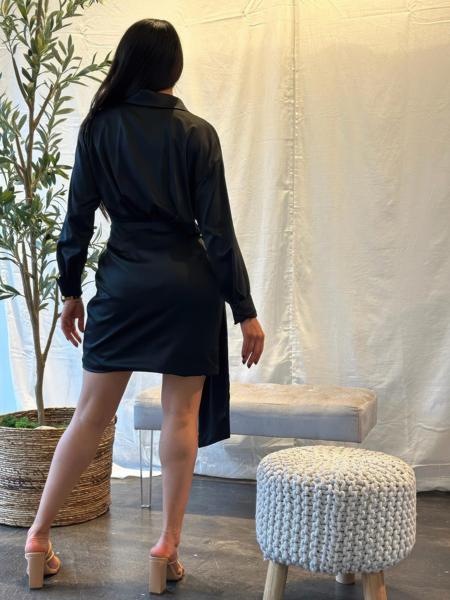 Black wrap mini dress back view, long sleeves, adjustable tie waist