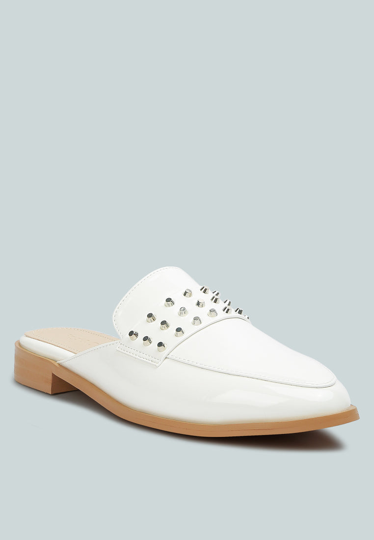Yashta patent studded flat mules (white) with studded strap across the vamp.