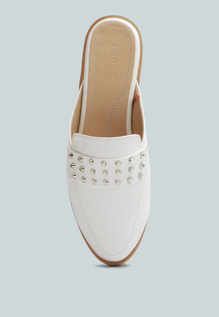Yashta patent studded flat mules (white) top view showing multiple metal studs.