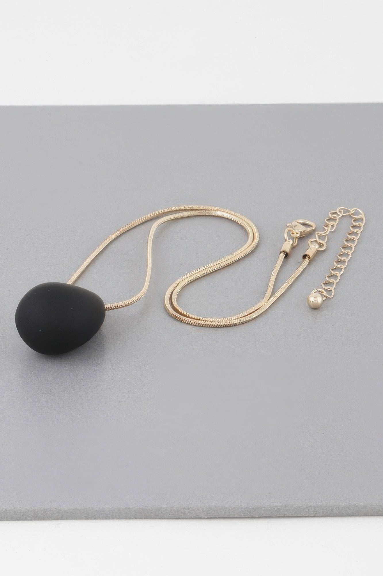 Yin Teardrop Necklace, gold chain with black teardrop pendant and lobster clasp