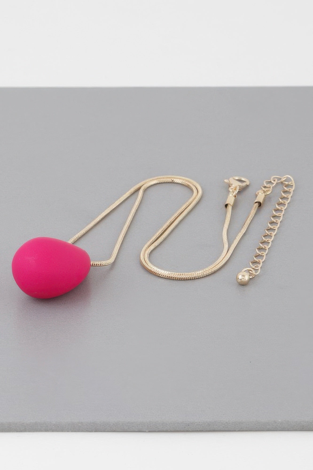 Yin Teardrop Necklace with gold chain and bright fuchsia teardrop pendant