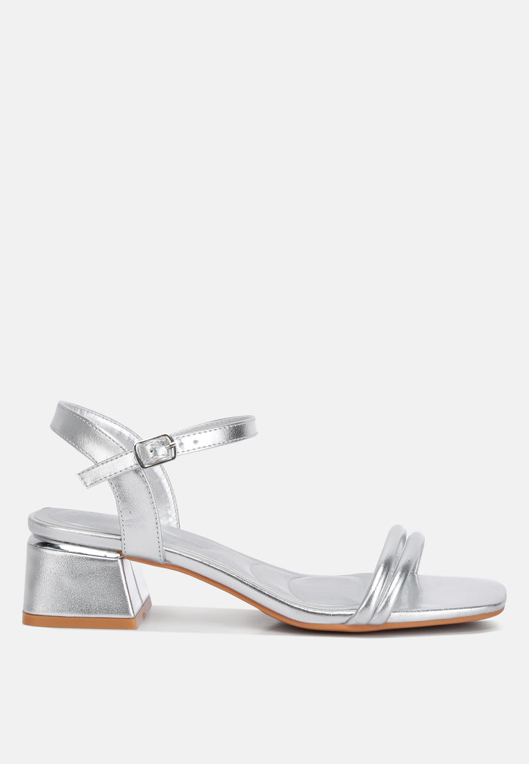Silver metallic ankle-strap low block heels with open square toe and buckle