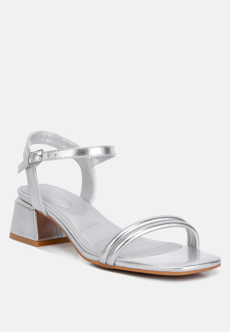 Silver metallic low block heel sandal with ankle strap and metallic toe strap