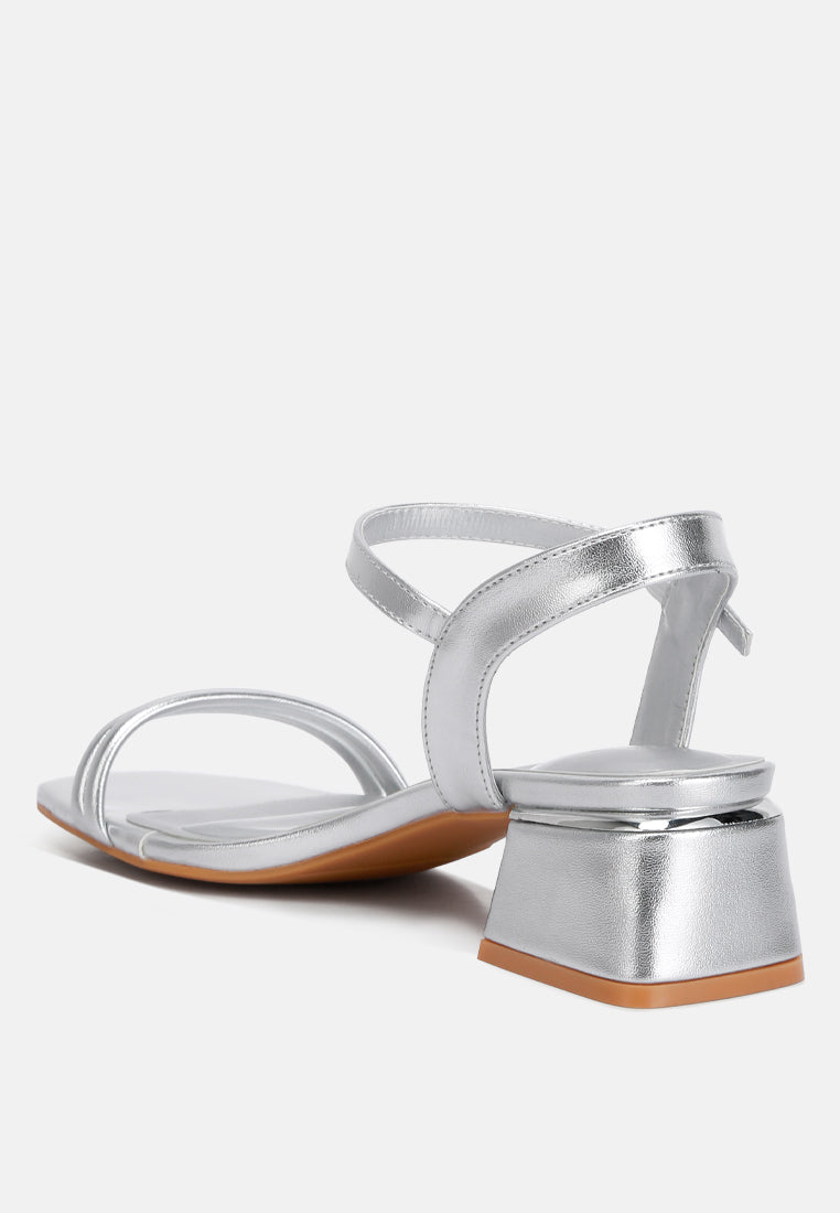 Silver metallic T-strap sandal with open square toe and low block heel