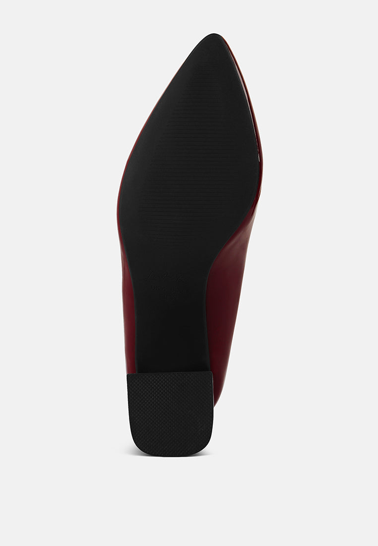 Dark pointed-toe pump with flared block heel and textured sole
