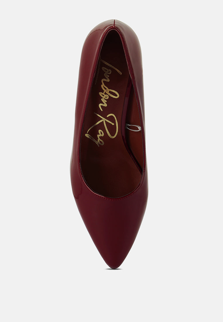 Burgundy pointed-toe pump showing interior lining and curved silhouette