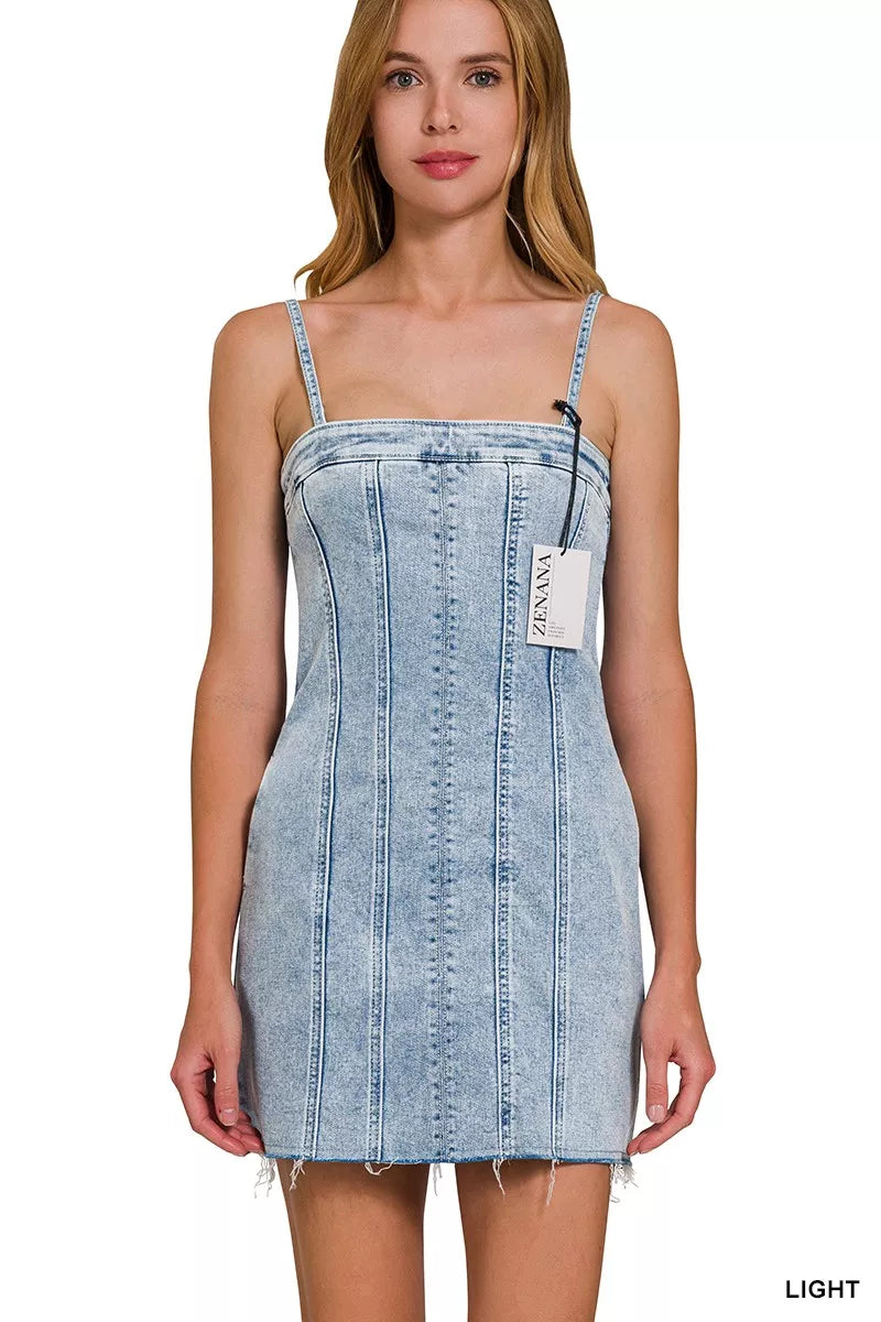 Light-wash denim spaghetti strap mini dress with exposed seams, front view