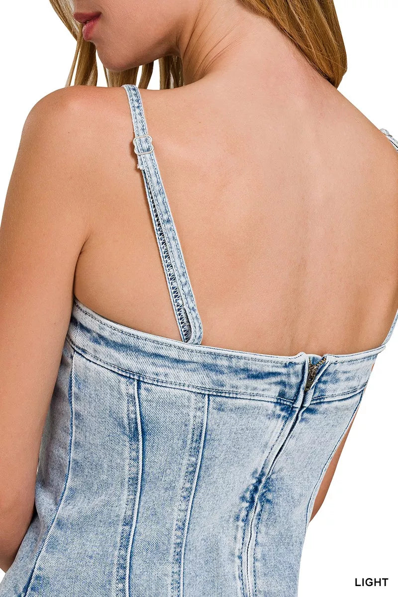 Back close-up: light-wash denim spaghetti strap mini dress with open back seam