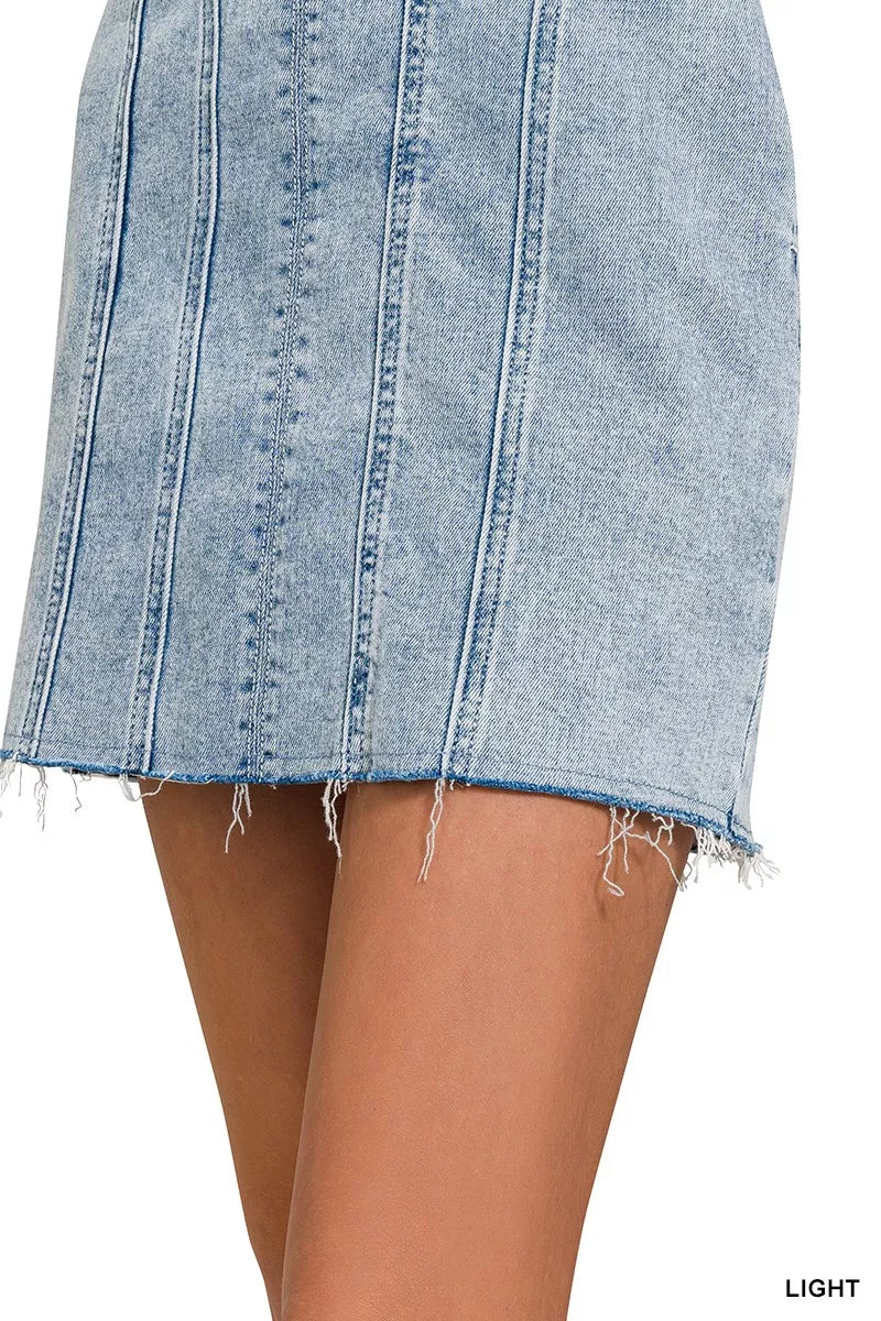 Light-wash denim dress skirt with exposed seams and frayed hem