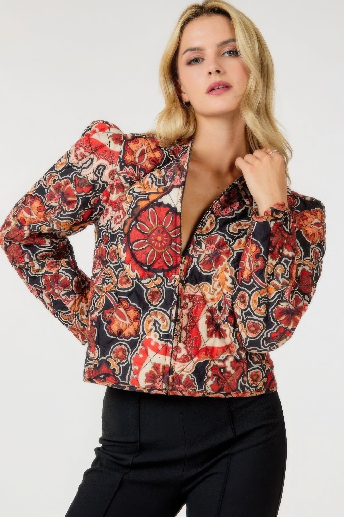 Black zip-up multi-print jacket with red floral and paisley pattern, full front zipper.