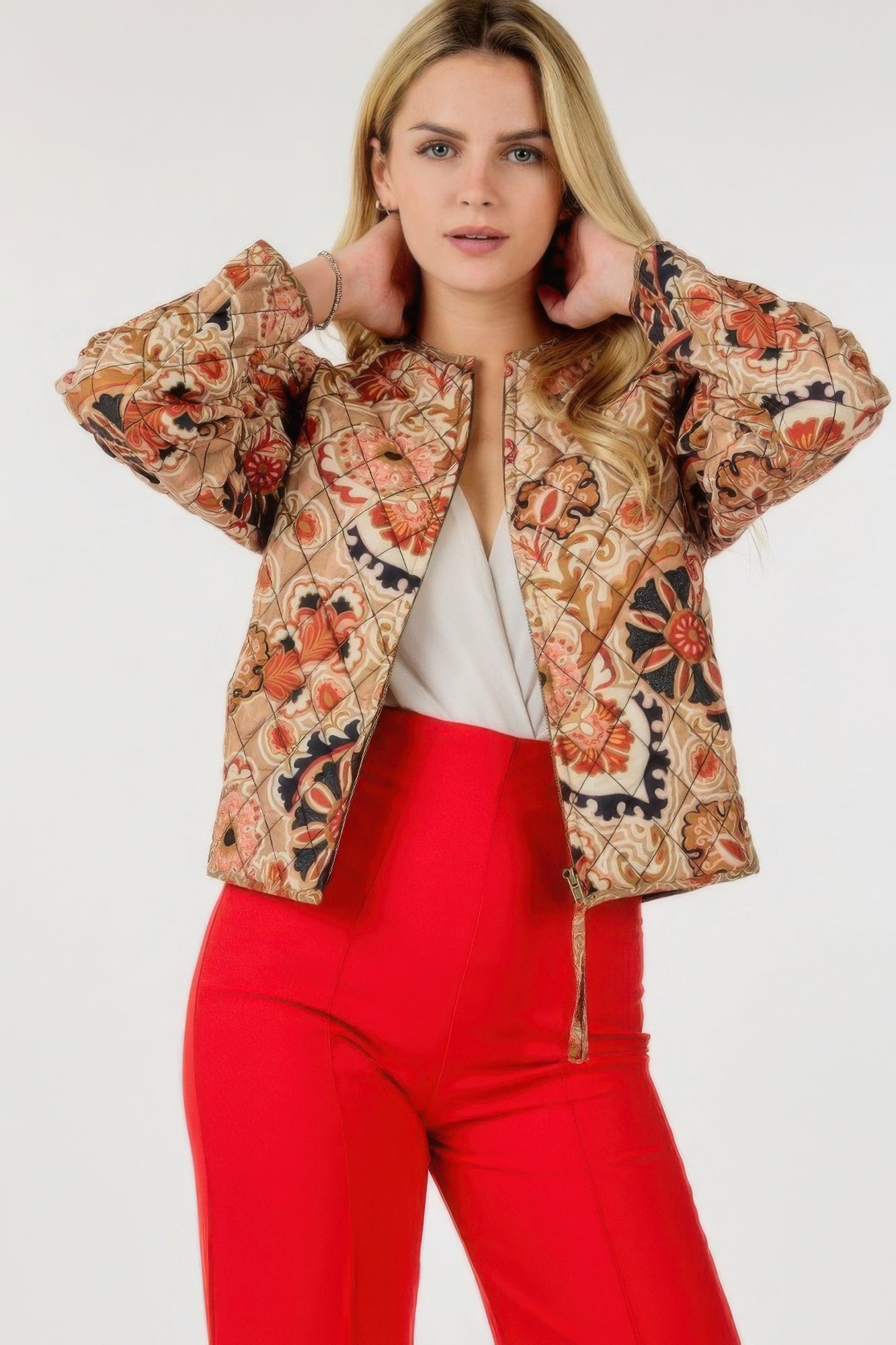 Tan zip-up multi-print jacket with orange floral/paisley pattern and button-front detail at cuffs.