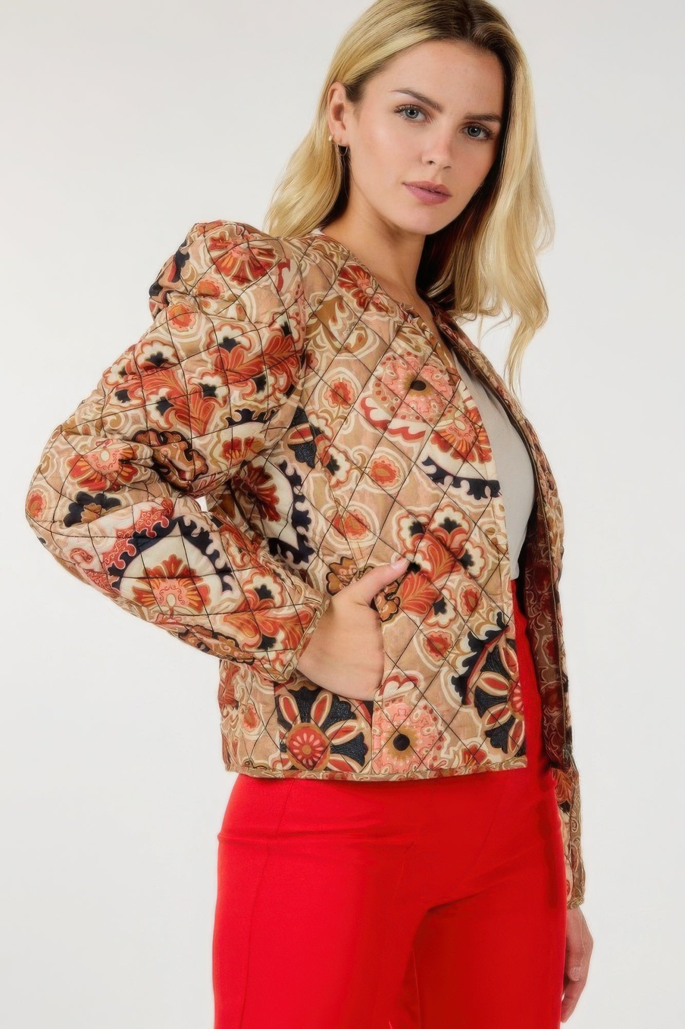Tan zip-up multi-print jacket with orange and navy floral paisley, dark front zipper placket.