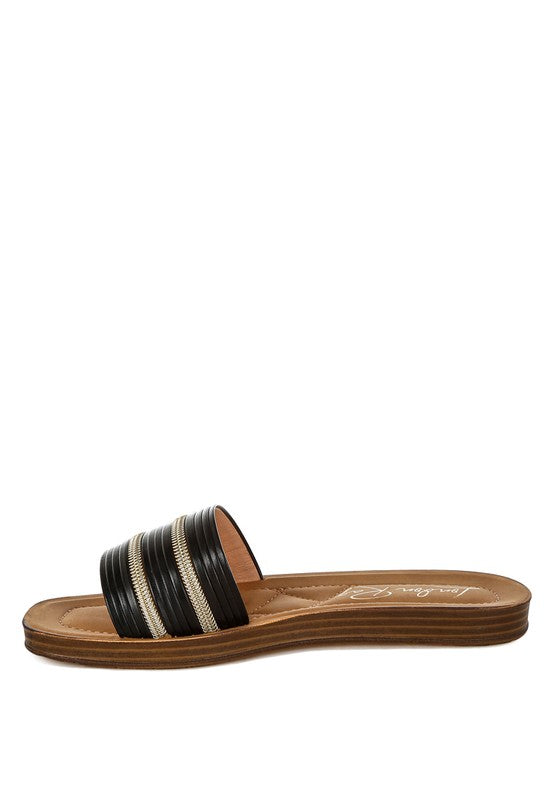Black slip-on slide sandals with faux zipper stripe bands and flat sole