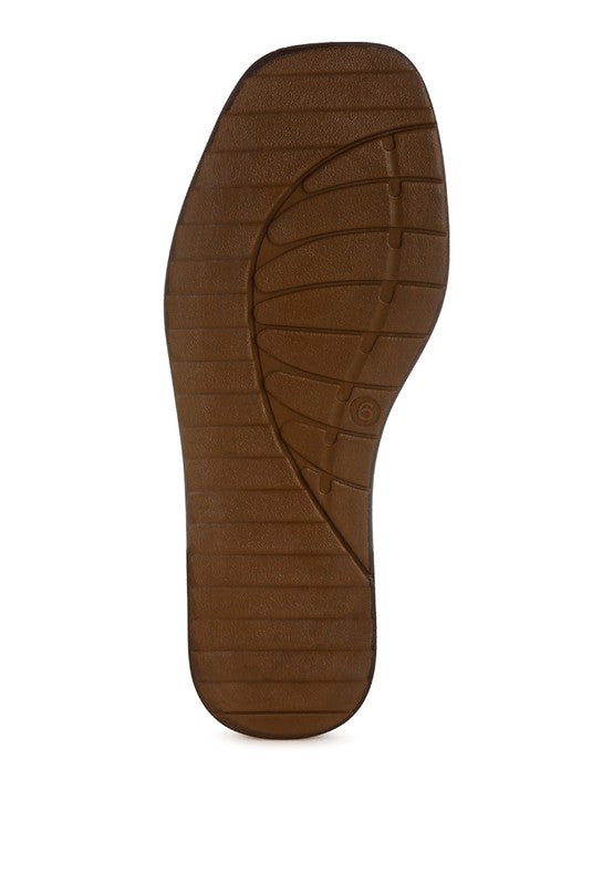 Brown rubber outsole for slip-on shoes with textured traction lines