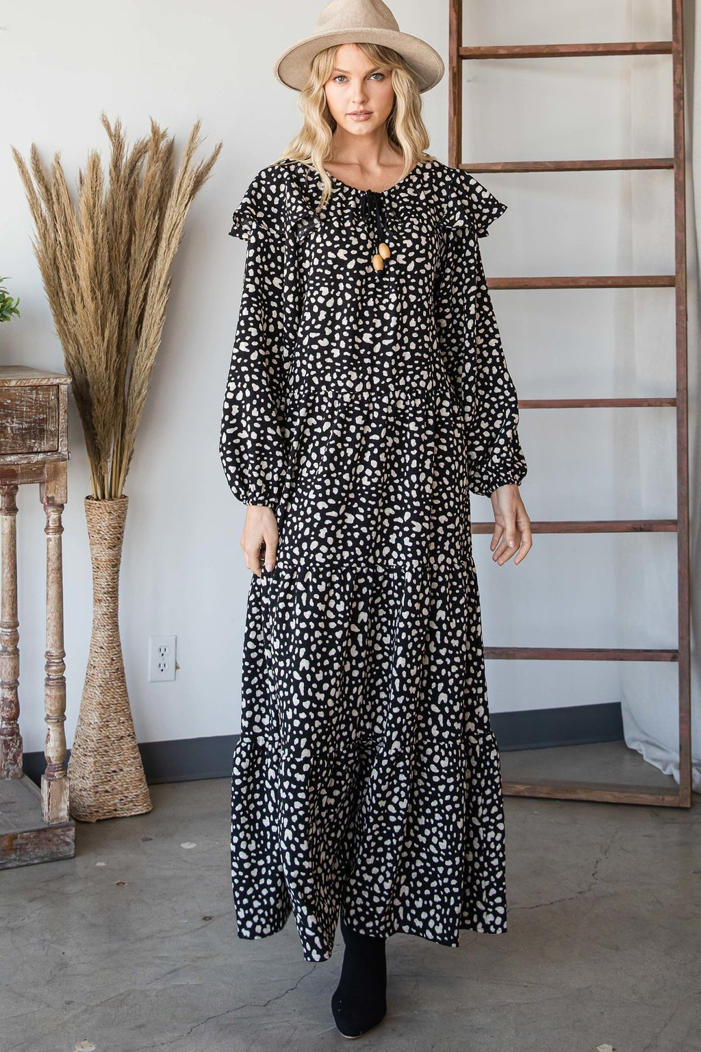 Black-and-white boho maxi dress with puff sleeves and irregular heart-like print