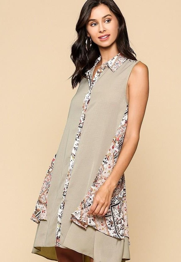 Sleeveless collared printed dress from the front, stone body with floral border