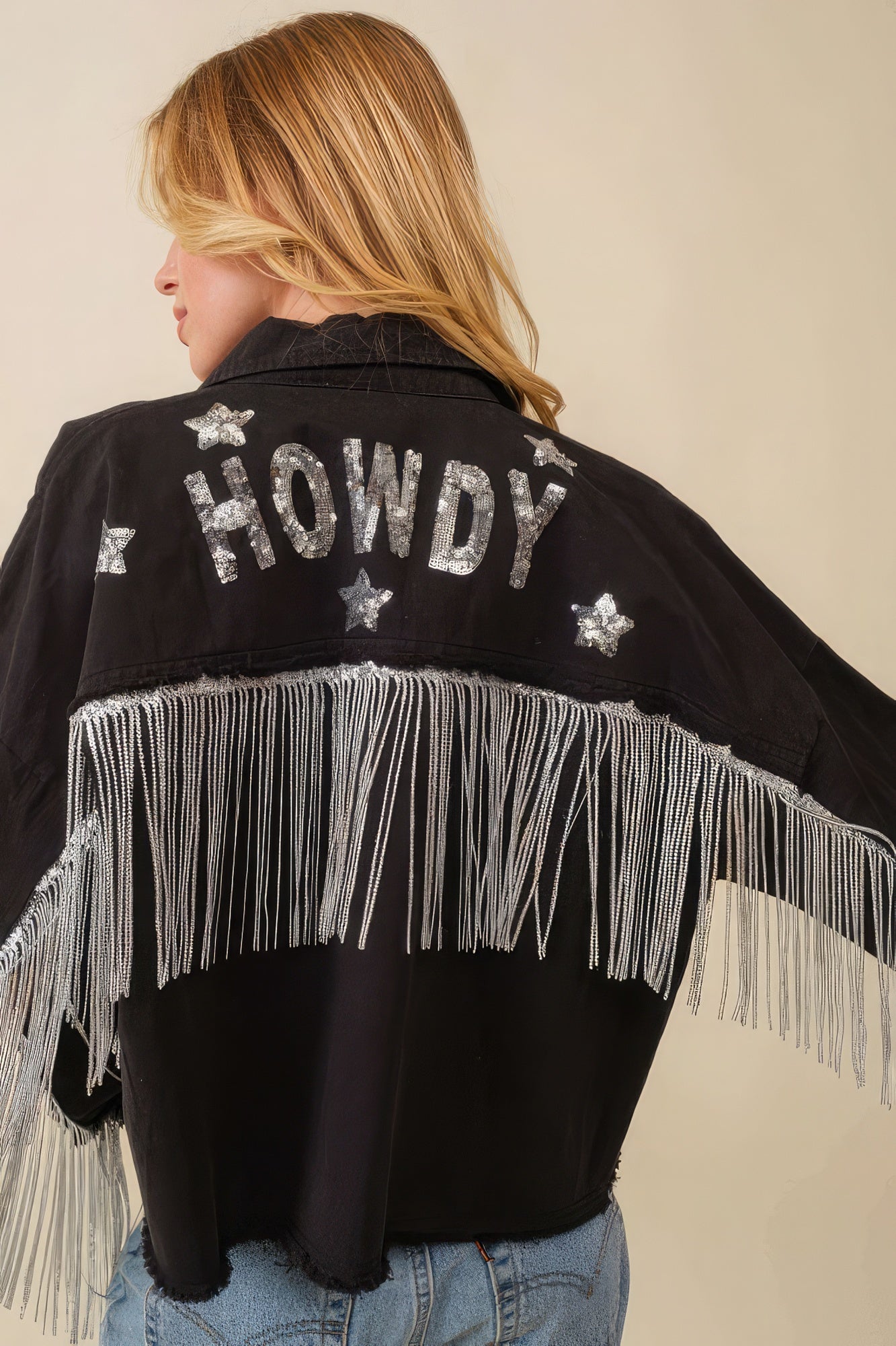 Black Howdy jacket back with “Howdy” and stars, silver fringe across the yoke
