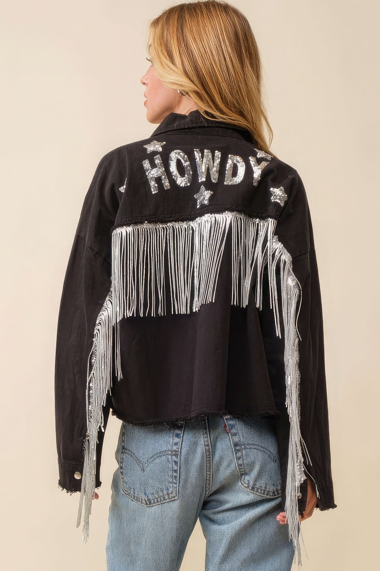 Black Howdy jacket back with “Howdy” and star patches, fringed front band