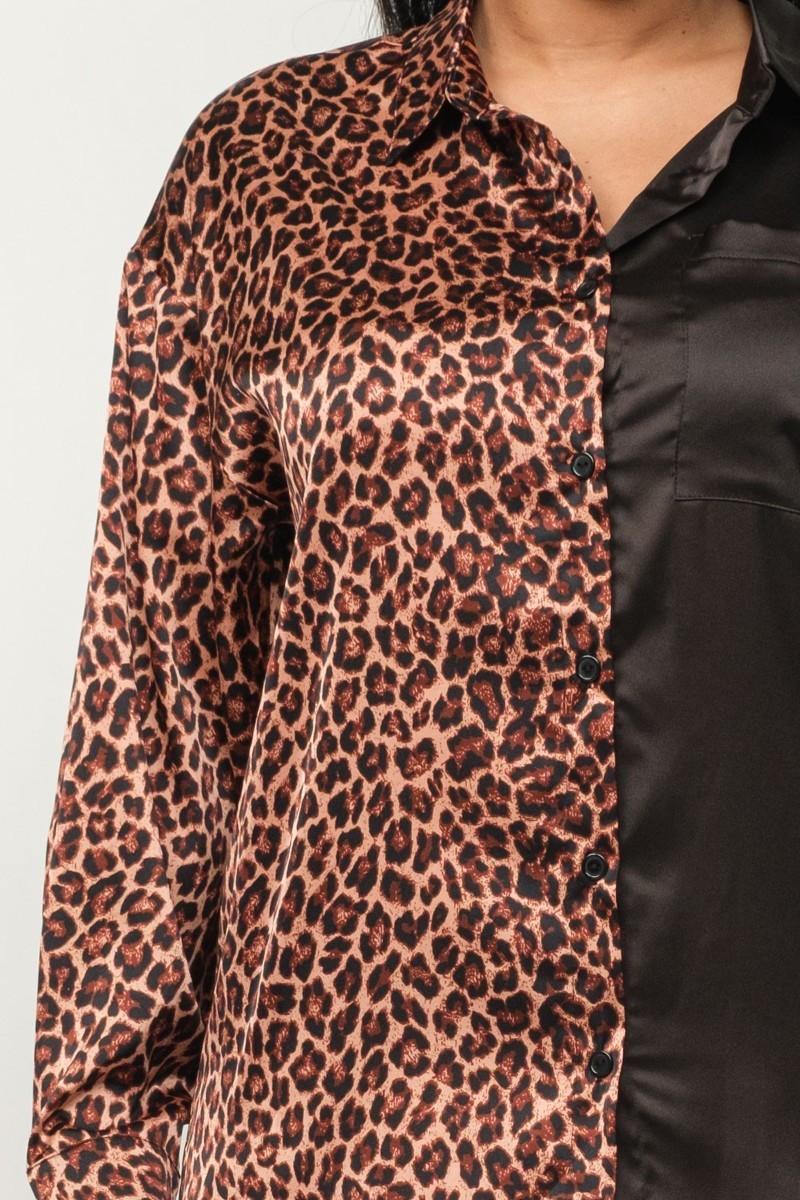 Leopard-print blouse half with black satin side; button-front detail