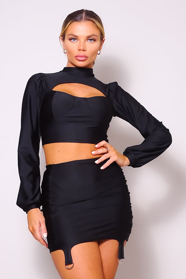 Black long-sleeve turtleneck blouse with front cutout and ruched garter mini skirt set