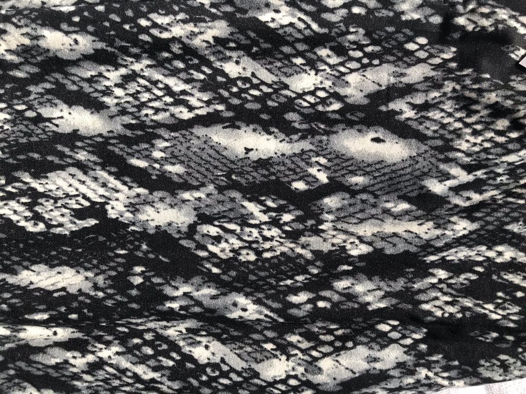 Snake-print fabric texture, black multicolor with mottled light-gray pattern