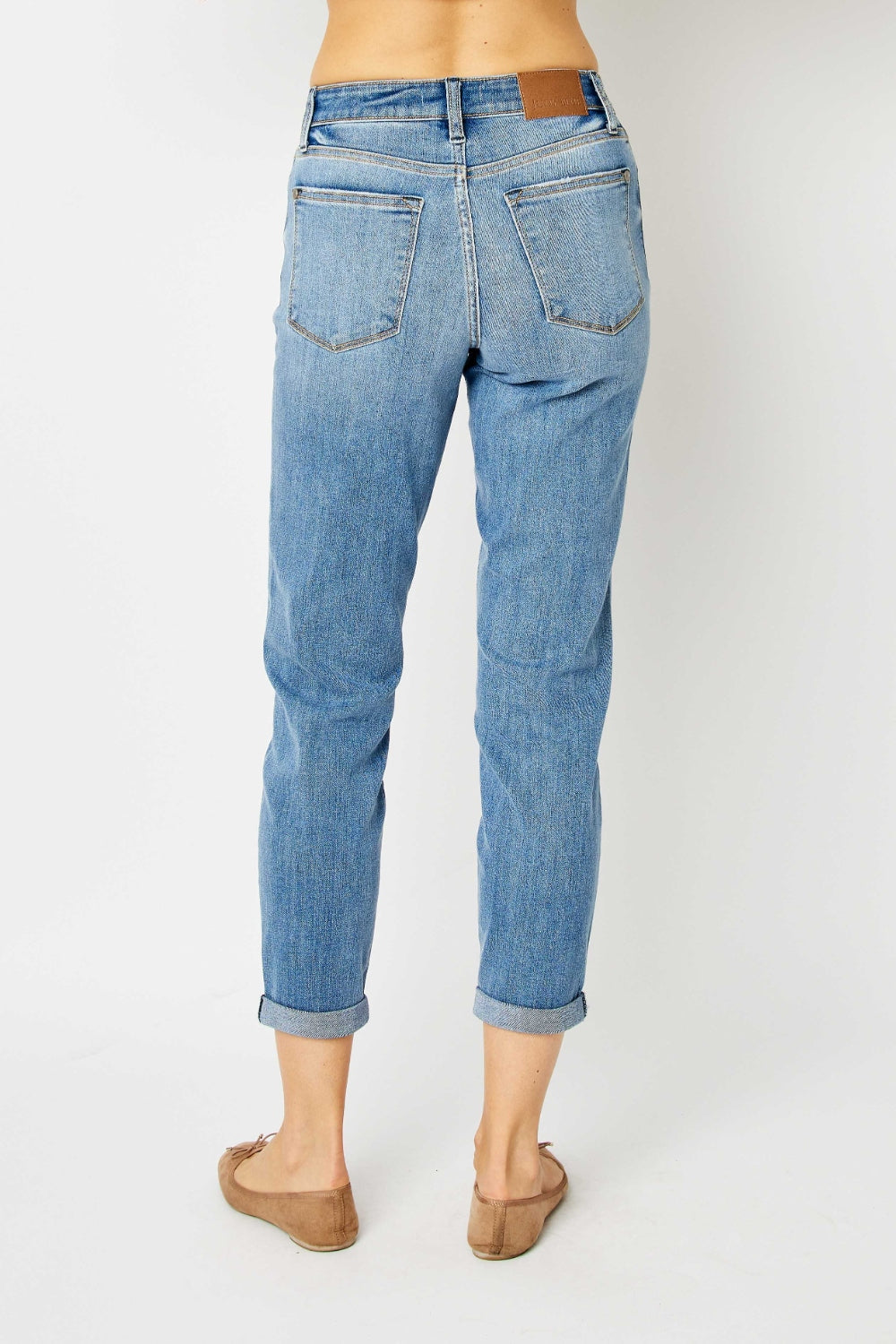 Medium blue denim slim jeans, cuffed ankle hems, back patch pockets and stitching