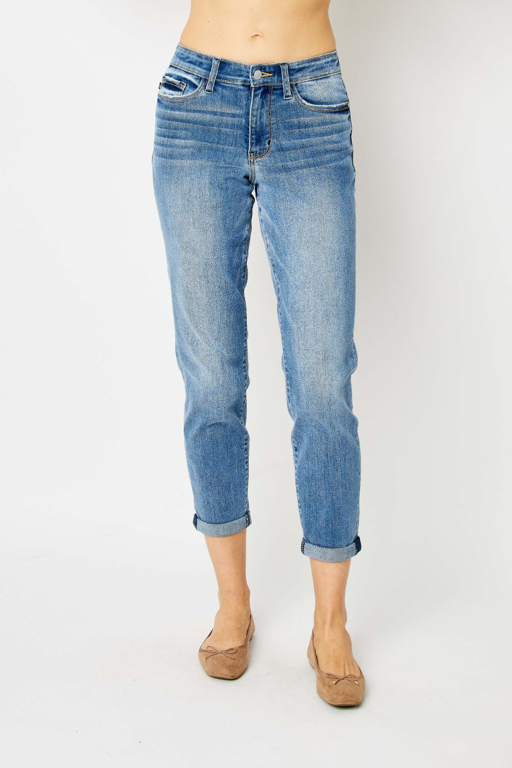 Slim jeans in medium blue wash, cuffed hems, curved back yoke seam
