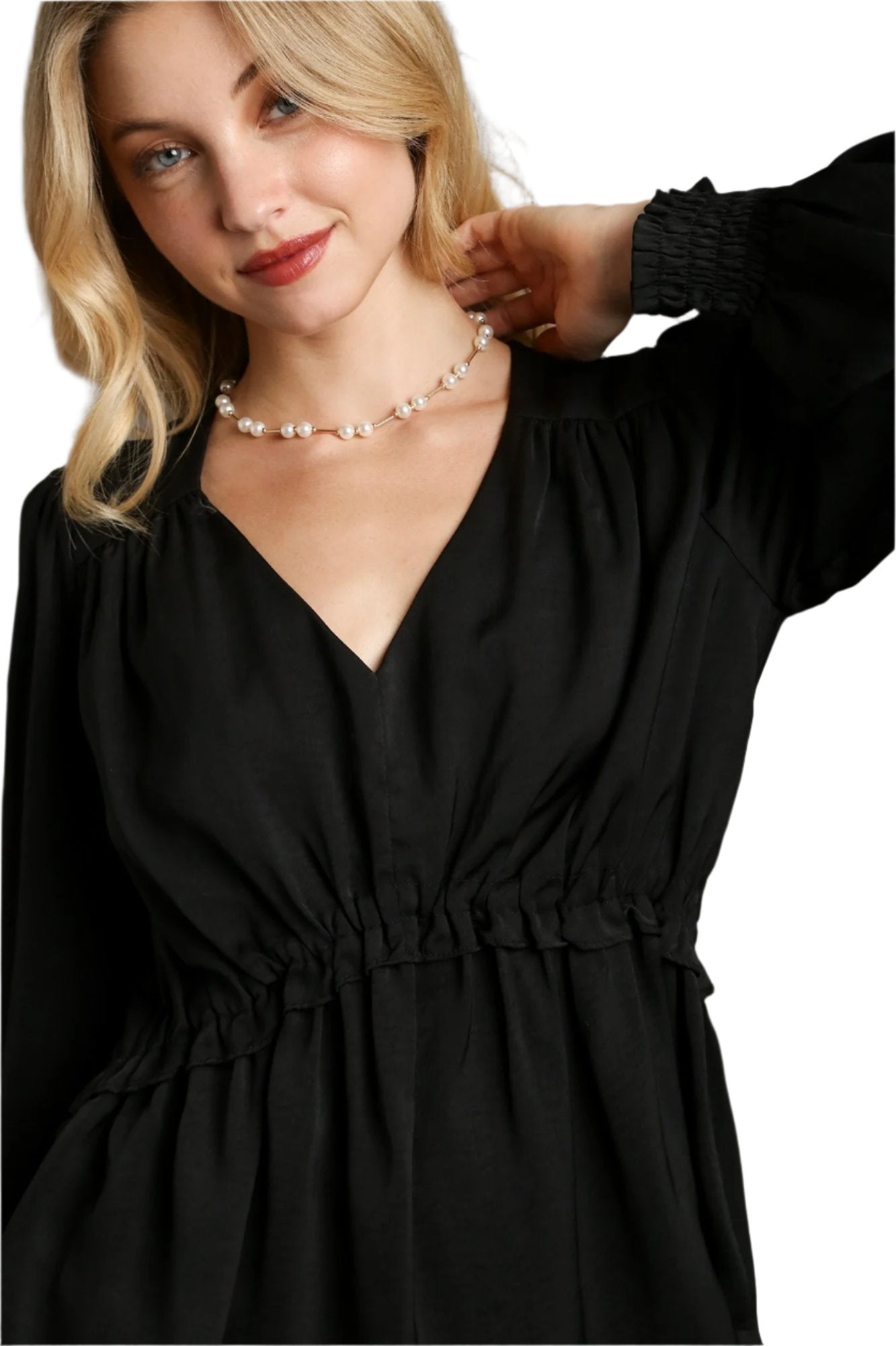 Black satin V-neck baby doll top with gathered waist, long puff sleeves, and ruffle trim
