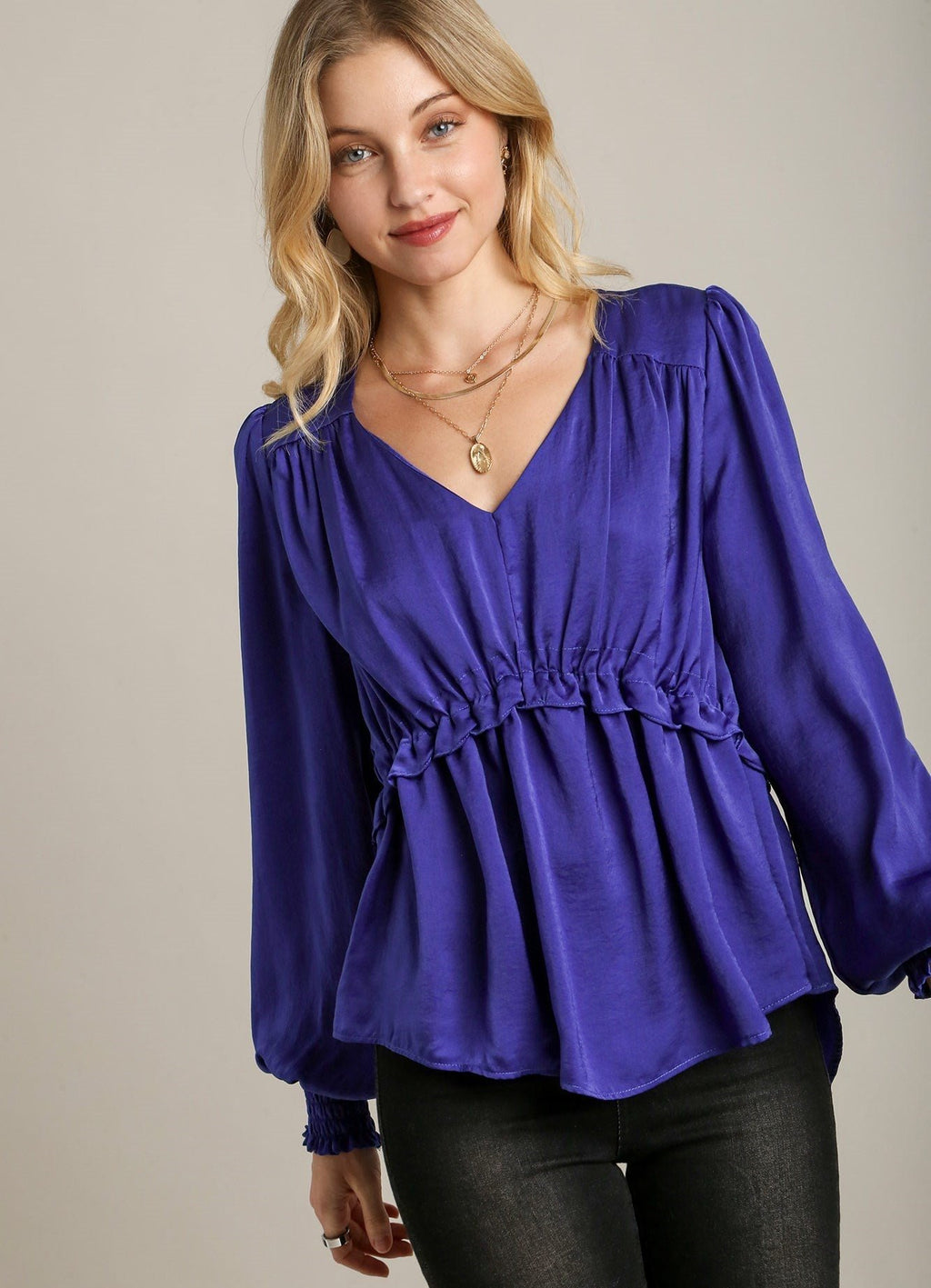 Blue satin V-neck baby doll top with ruffled neckline and cuffed long sleeves