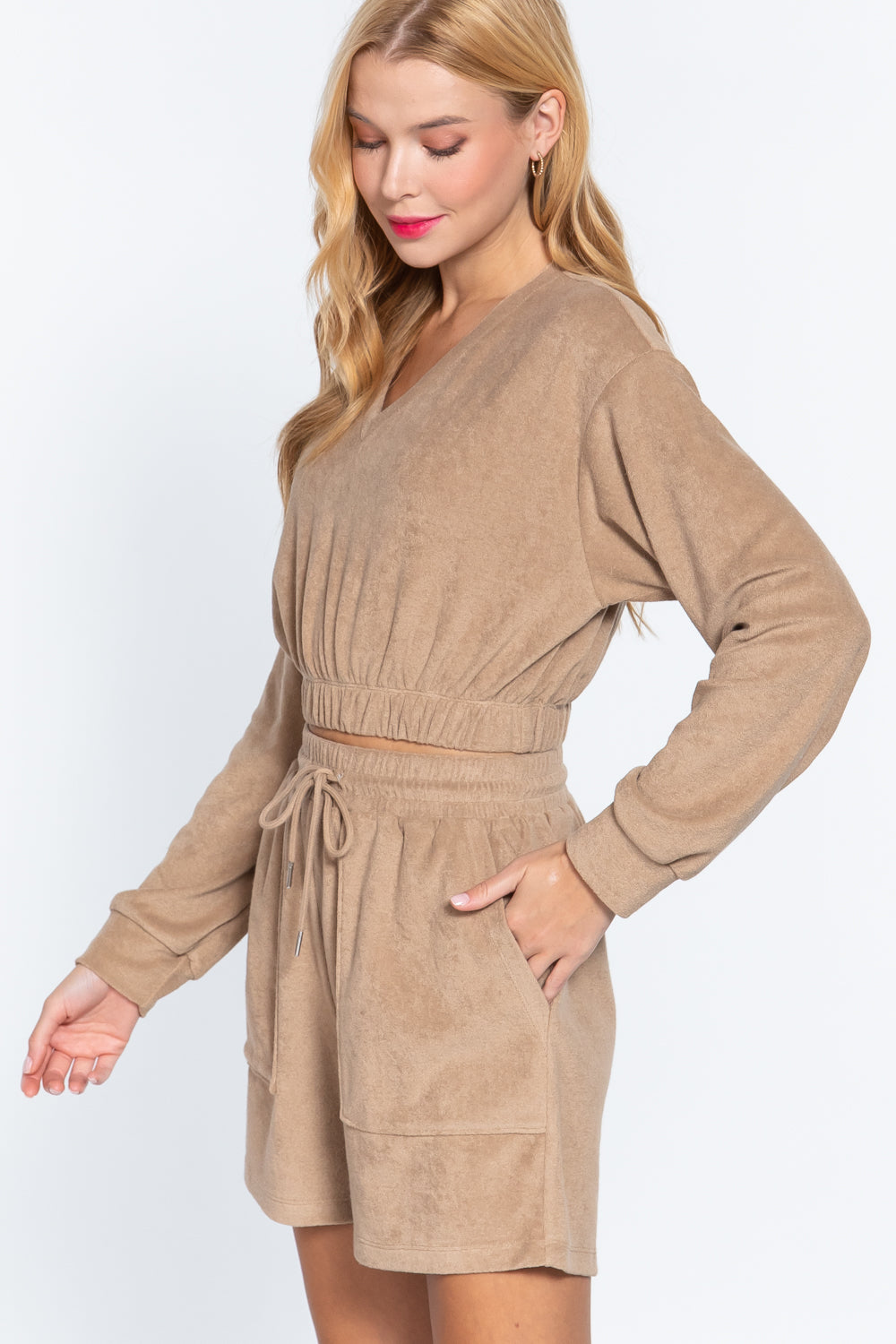 Mocha terry toweling top with V-neck, elastic waist hem, relaxed long sleeves