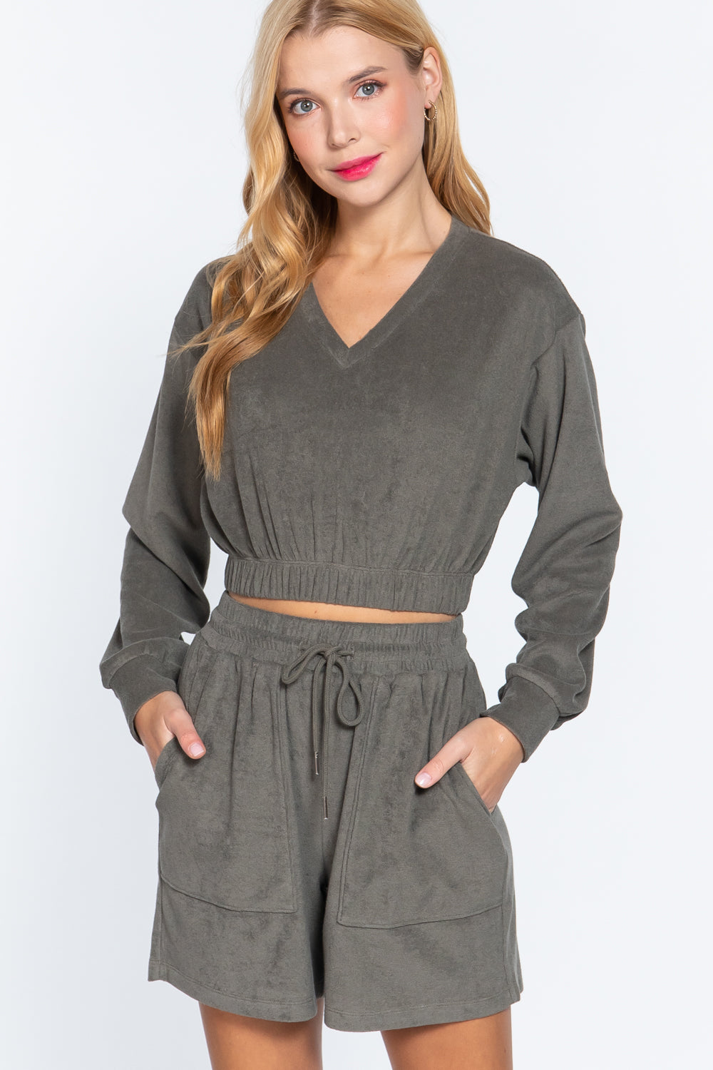 Olive terry toweling top with V-neck, elastic waist hem, long sleeves