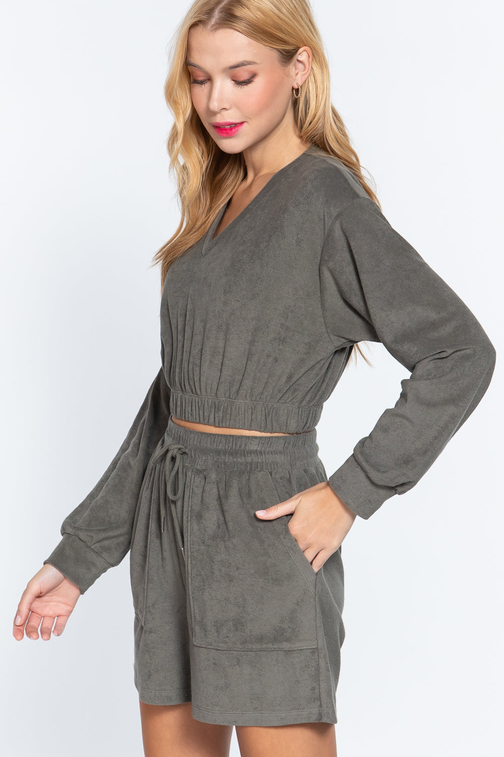 Olive terry toweling top with elastic hem, long sleeves, V-neck and gathered waist