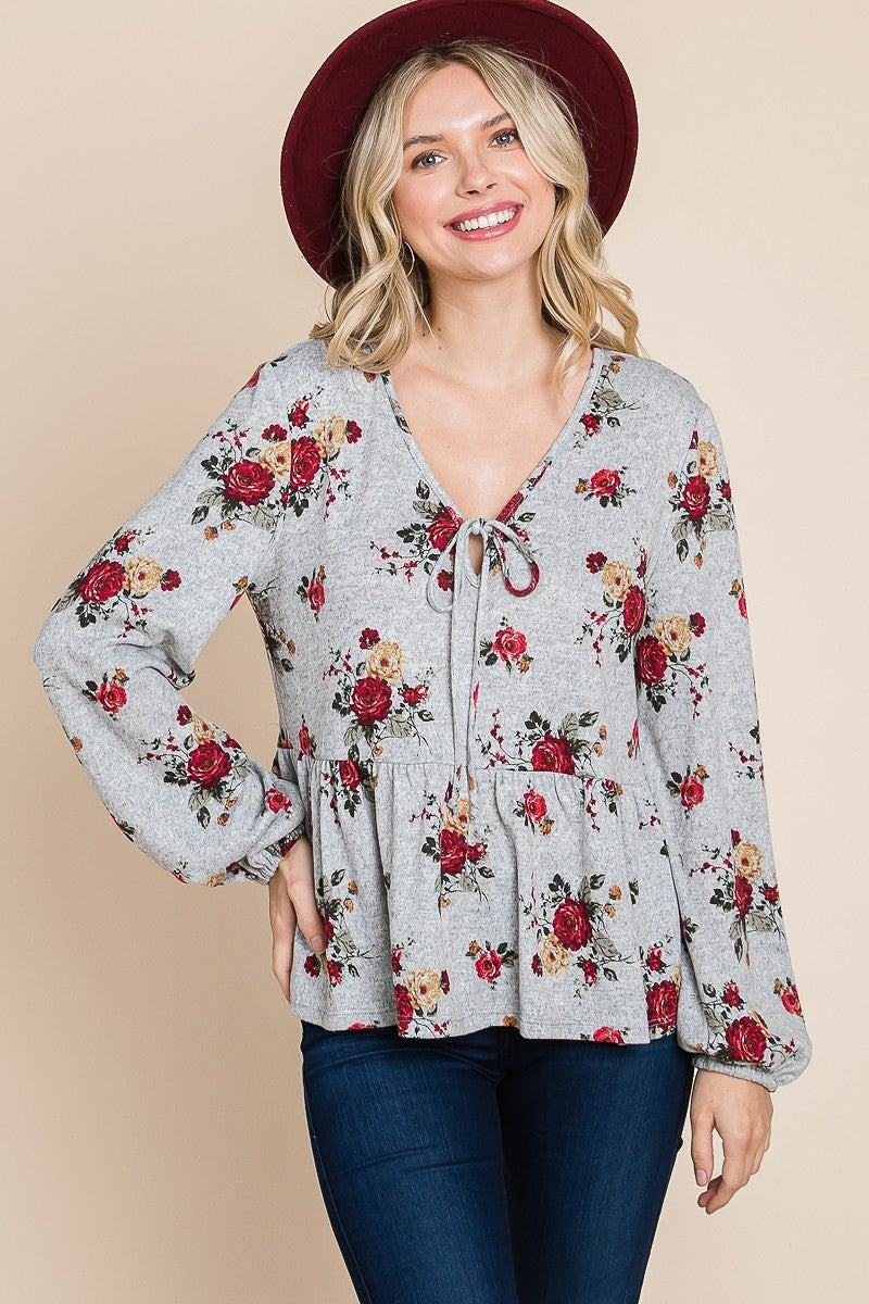 Tigbul's floral printed babydoll blouse with bow-tie neckline and long elastic sleeves, grey