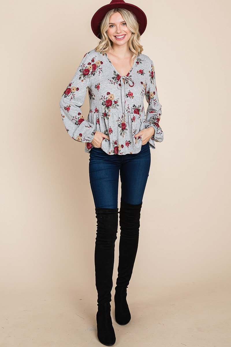 Floral babydoll top with long elastic cuffs and tie V-neck; grey with red rose print