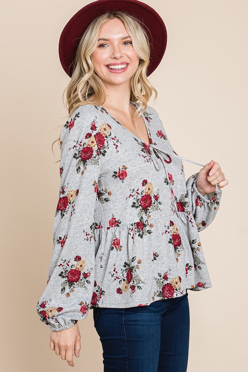 Floral babydoll blouse with bow-tie V-neck and gathered waist, grey with rose print