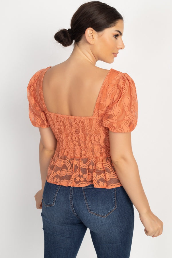 Rust sheer lace top with square back, puff sleeves, and flared peplum hem