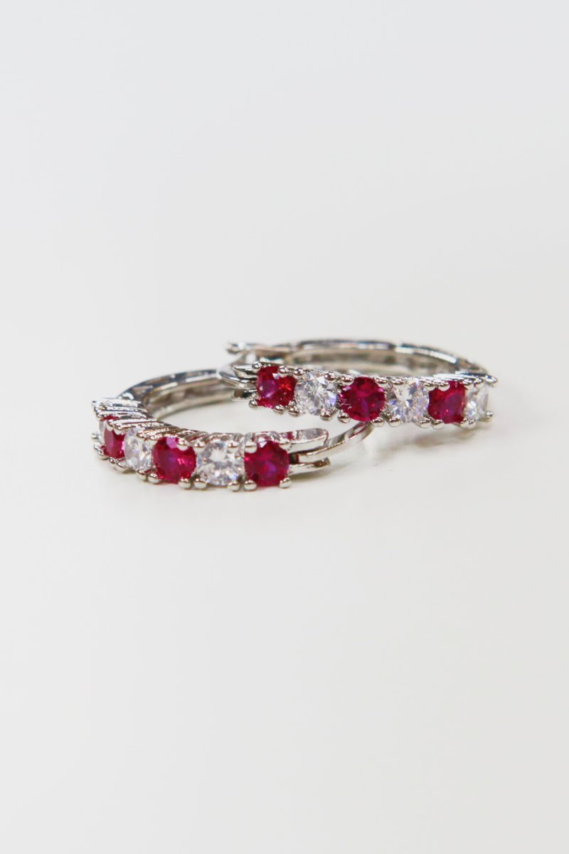 Silver hoop earrings 3/4in with fuchsia cubic zirconia row stones
