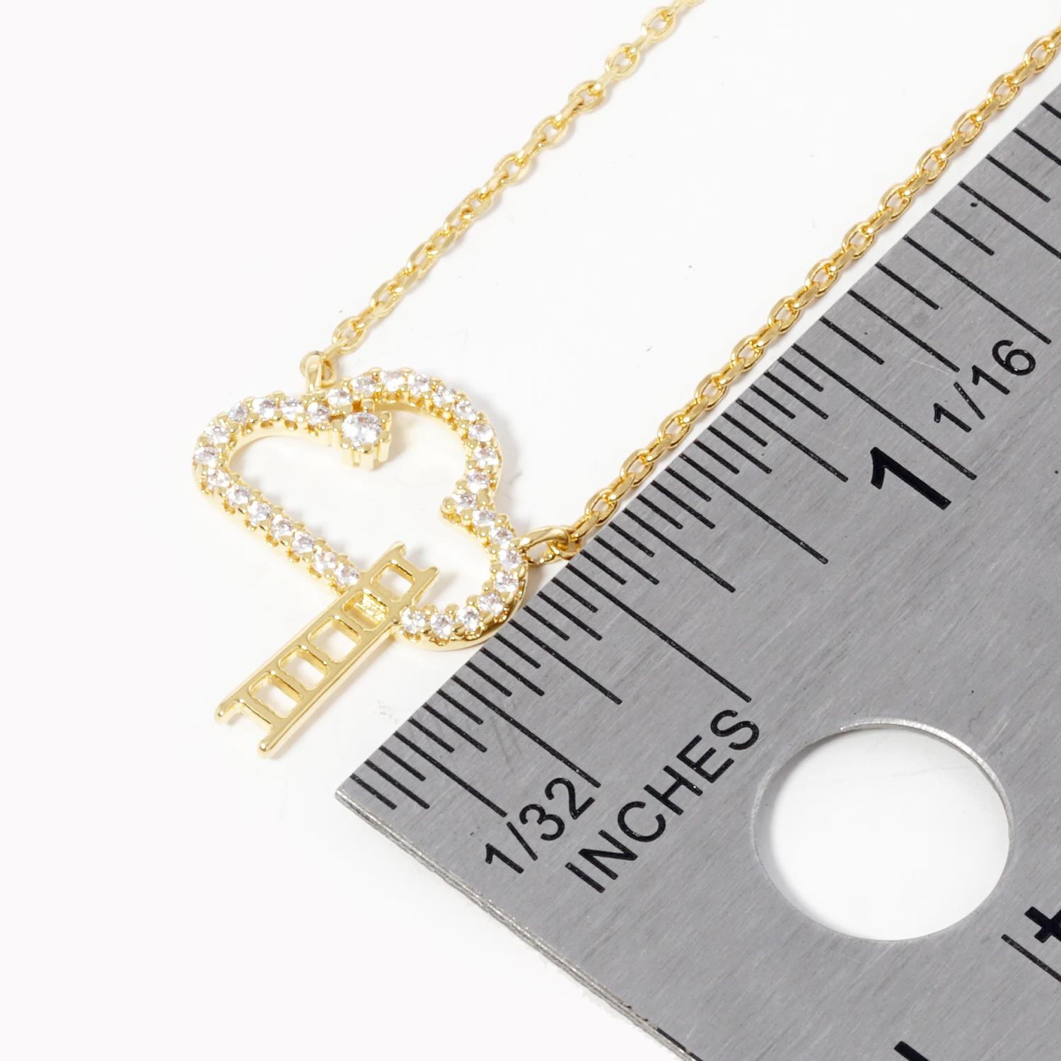 Cloud pendant necklace with rhinestone pavé cloud and vertical ladder charm; gold chain