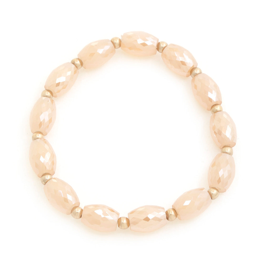 Beaded bracelet with beige faceted oval beads and gold-tone spacers
