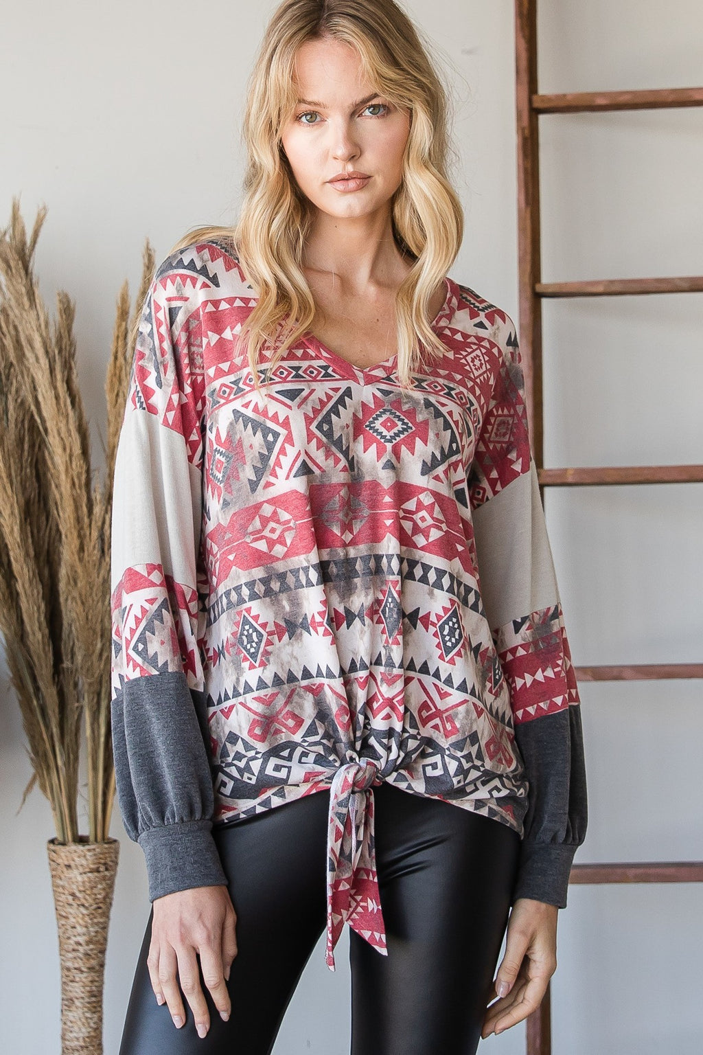 Aztec print long-sleeve sweater with front tie, red gray white geometric pattern