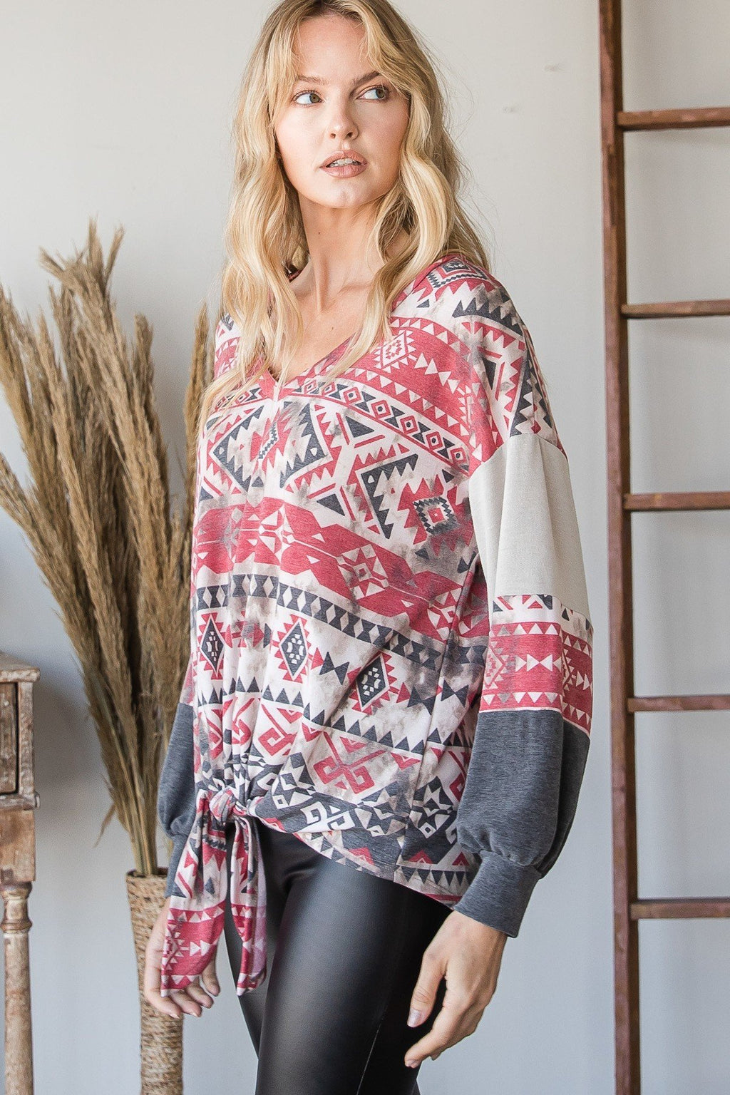 Aztec print long-sleeve sweater, red/gray/white geometric motif and tied hem