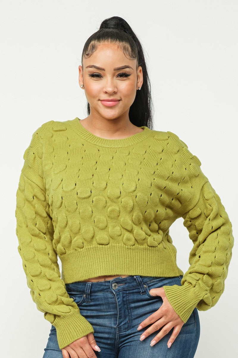 Lime green checker-knit sweater with raised texture and round crew neck