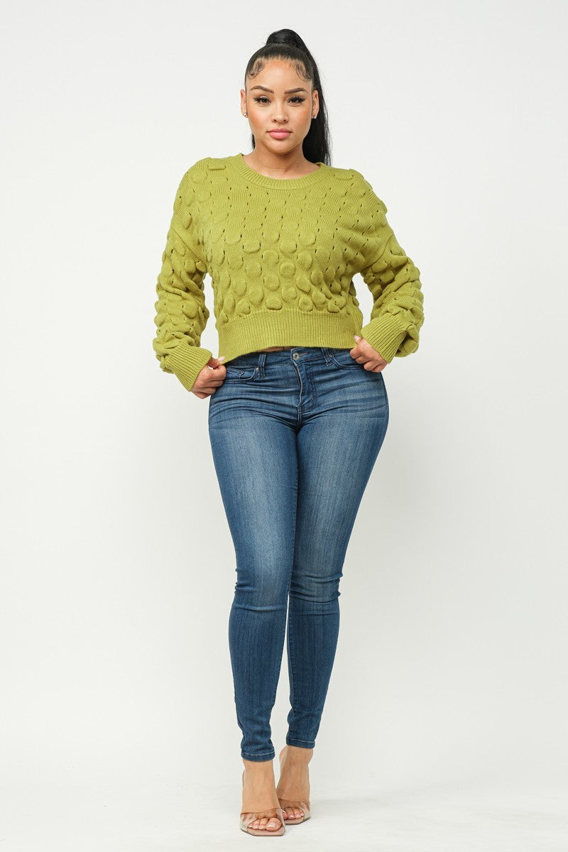 Lime green checker-knit sweater top with long sleeves and crew neck