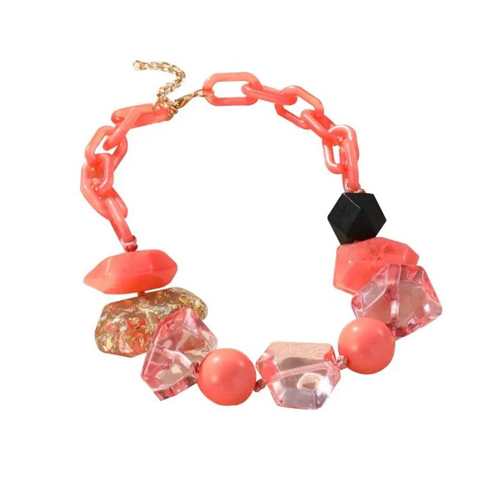 Blush/orange chunky beaded oval link necklace with faceted beads and black cube accent