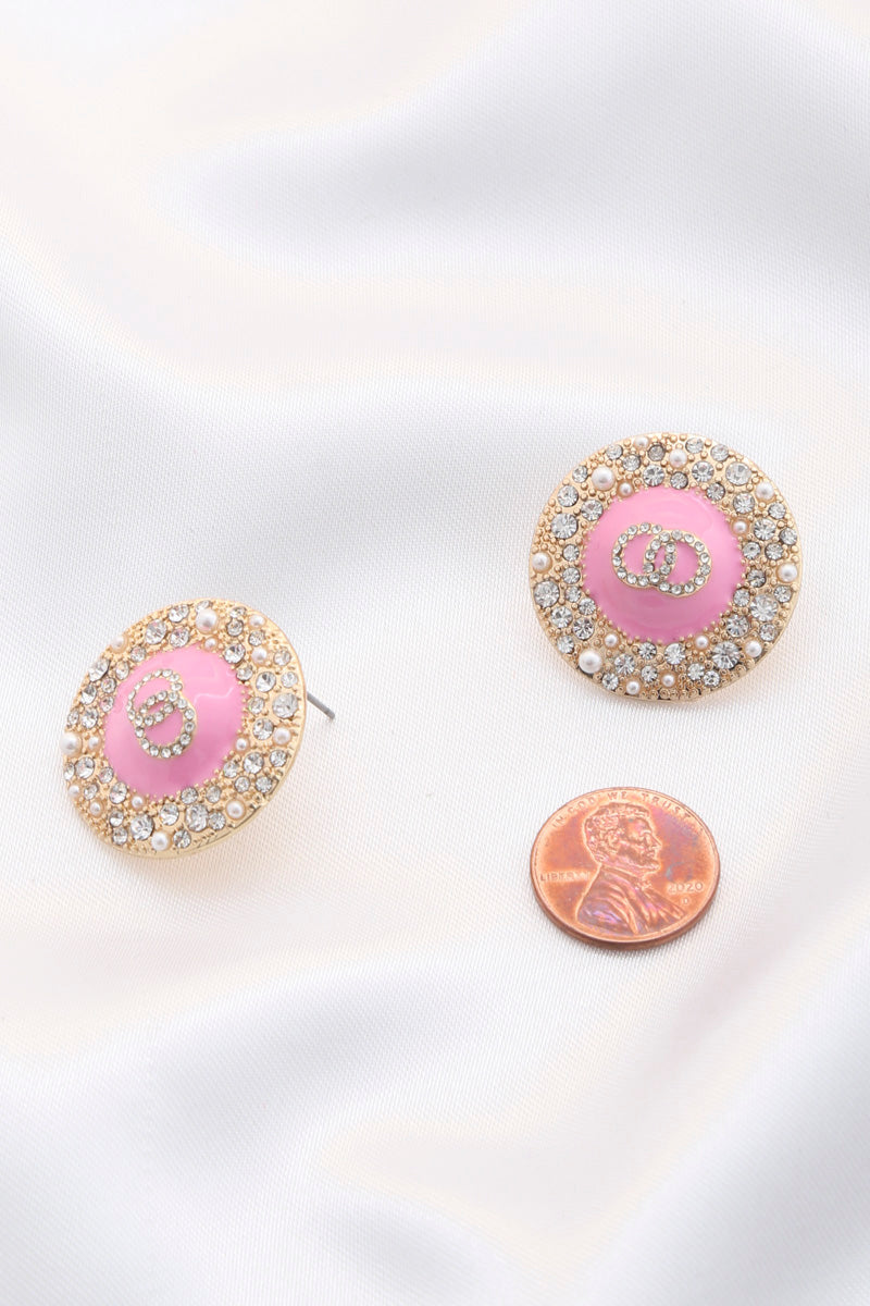 Pink double circle round metal earrings, rhinestone border, stud backs visible