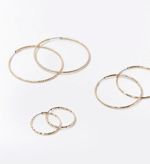 Gold etched hoop earrings: overlapping large hoops and small hoop pair
