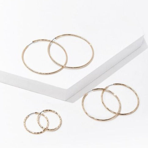 Etched hoop earring set, gold-tone: three hoop pairs in close view