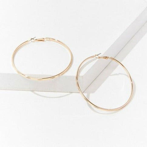 Gold etched hoop earrings, 2.5 in, flat front view of pair