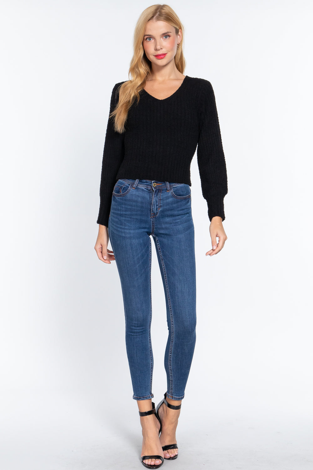 Black rib V-neck sweater with long sleeves and textured knit body