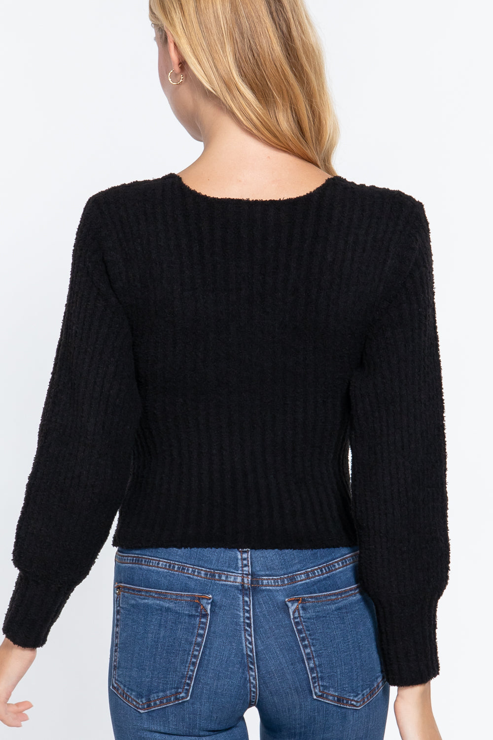 Black rib V-neck sweater, back view with long sleeves and knit texture